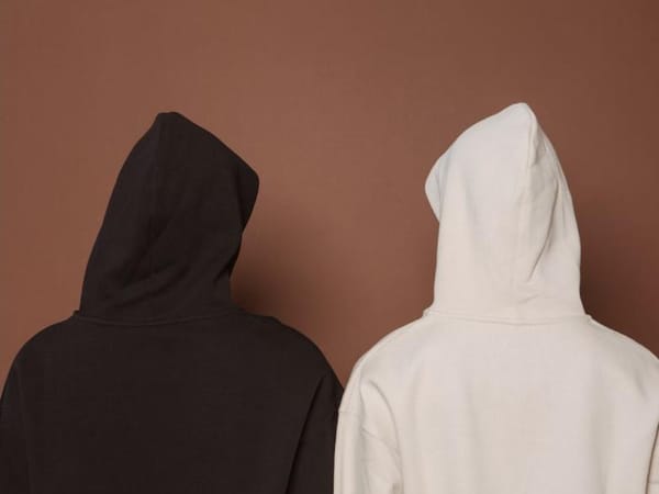 Brushed fleece hooded sweatshirts folded on a table