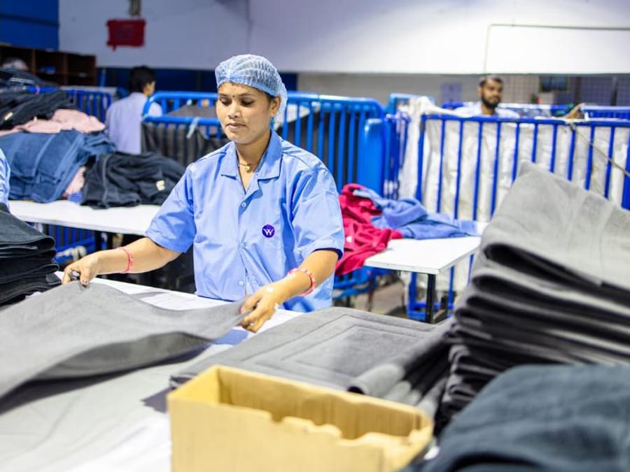 Final quality inspection of finished garments before packing